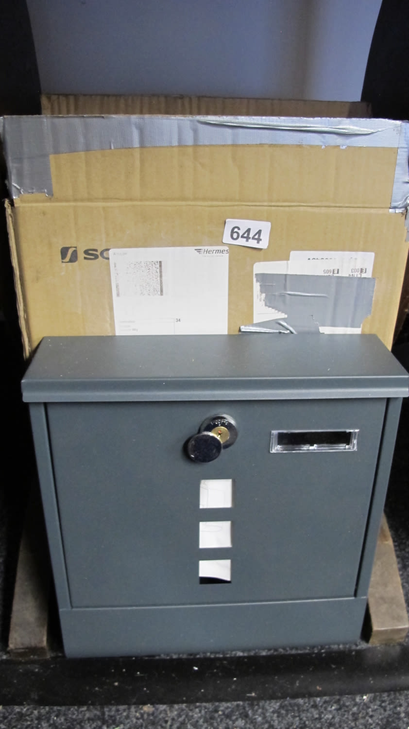 Lot 644: New locking post box new with key