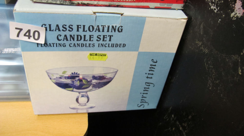 Lot 740: Glass floating candle set