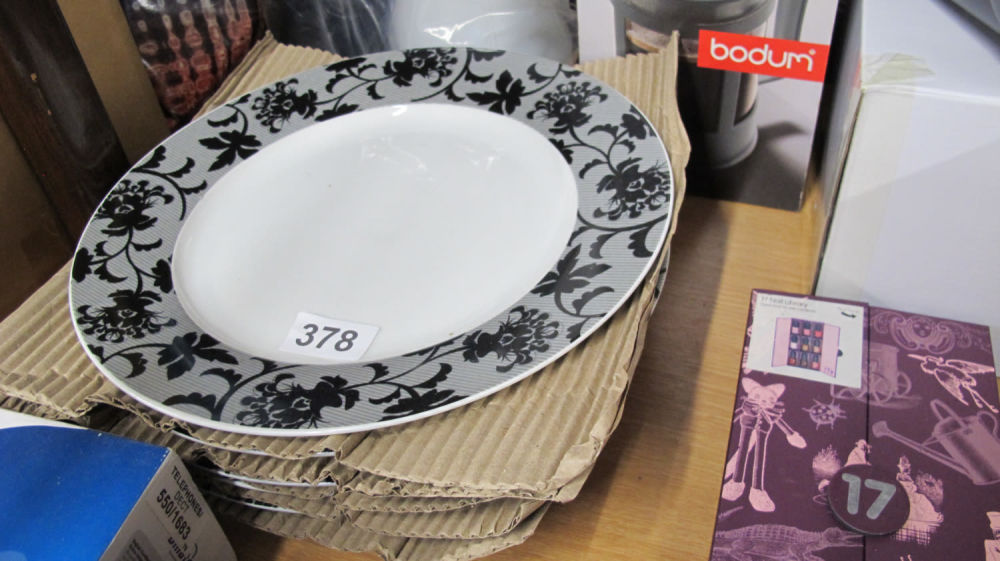 Lot 378: A quantity of new dinner plates