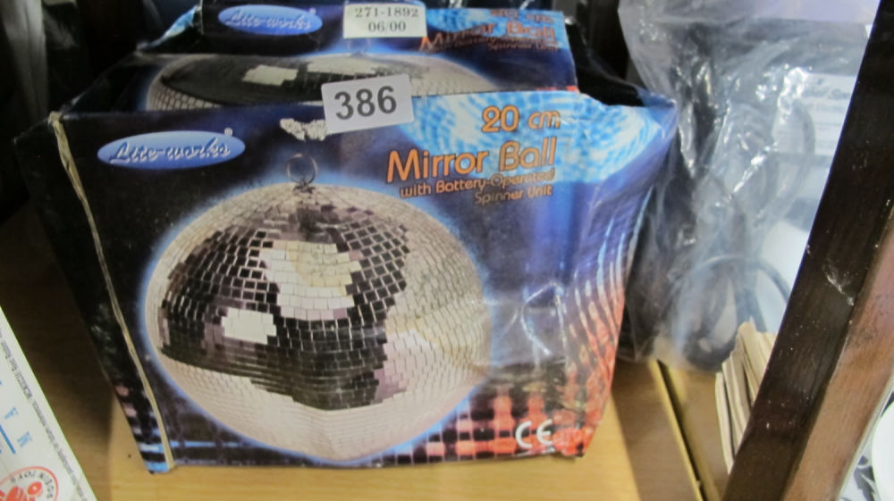 Lot 386: 20 cm disco mirror ball. let's get this...