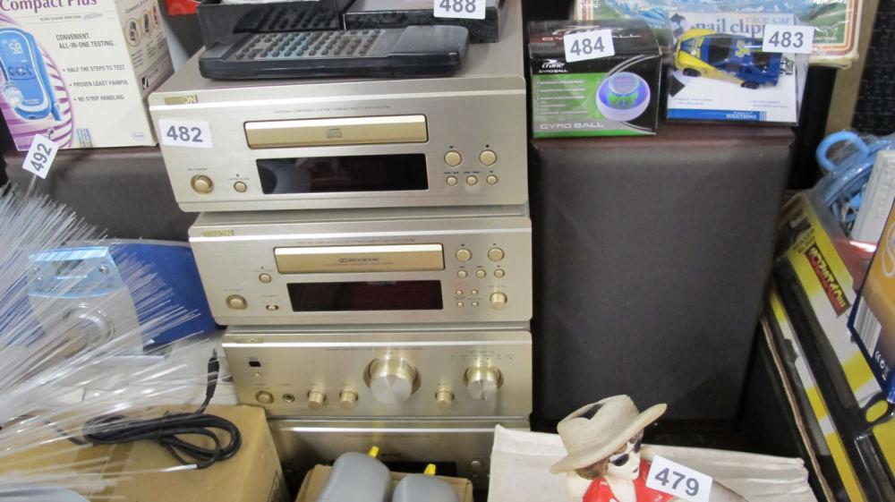 Lot 482: superb brushed gold Denon sound system with remote