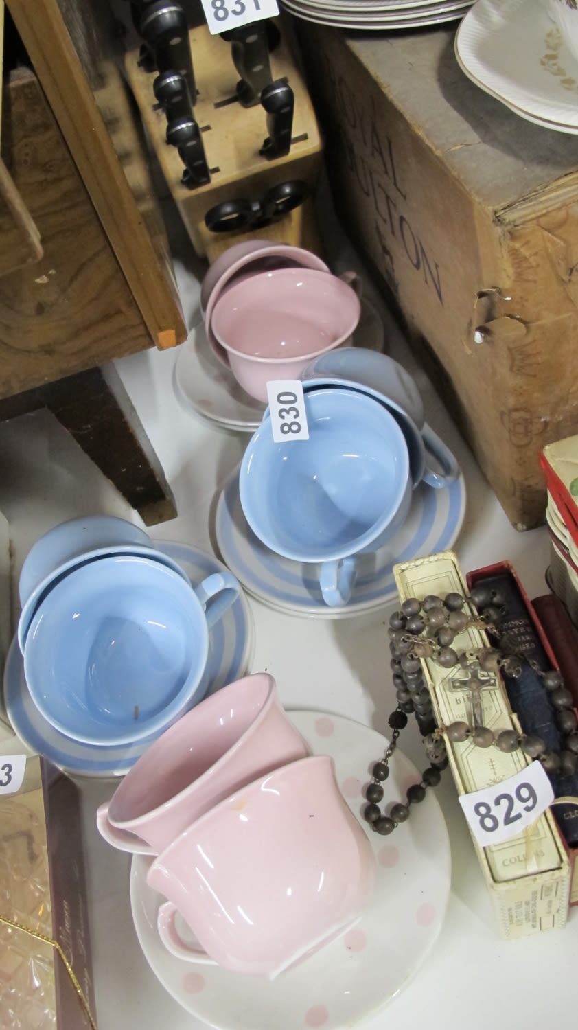 Lot 830: Colourful cups and saucers