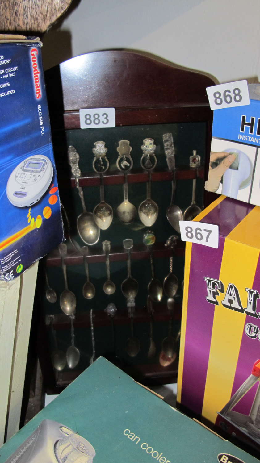 Lot 883: Collection of spoons with display stand