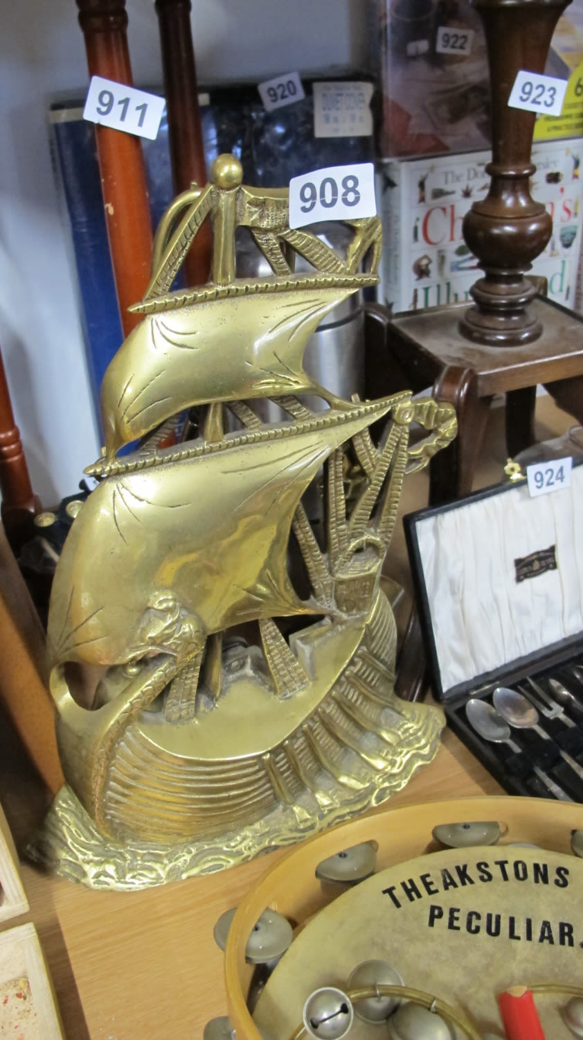 Lot 908: Brass ship doorstop