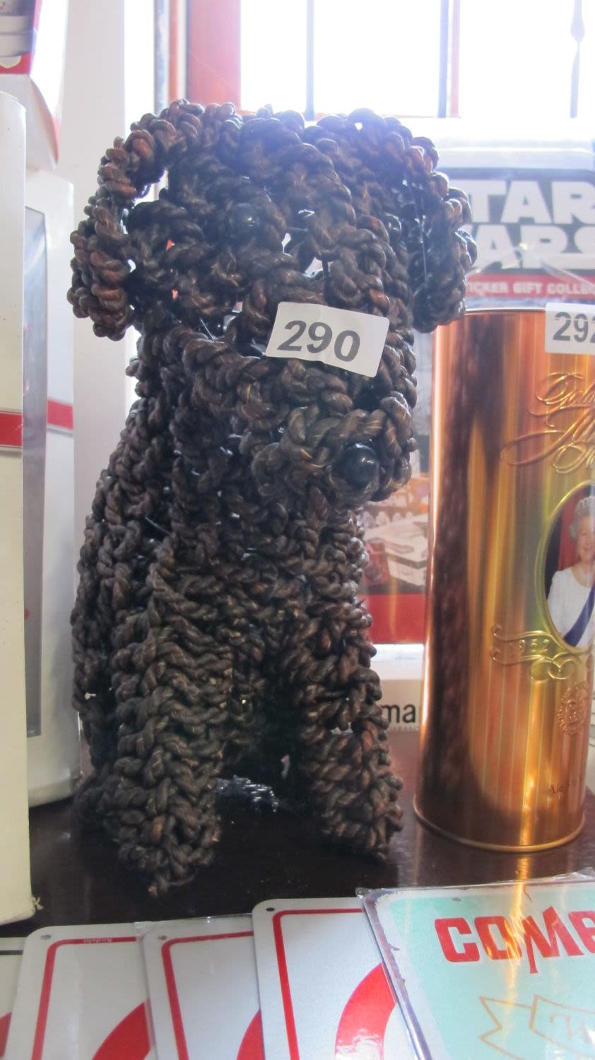 Lot 290: A wicker dog door stop