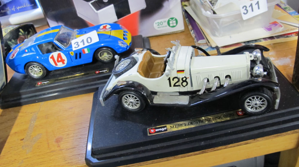 Lot 310: 2 Burago model cars. AF: one has damage...