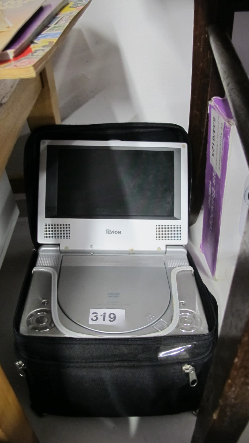 Lot 319: Tevion portable DVD player ideal for kids on...