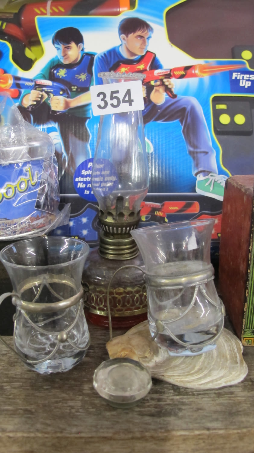 Lot 354: Oil lamp and unusual cups