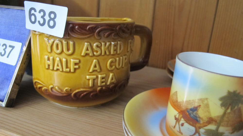 Lot 638: Novelty half tea mug