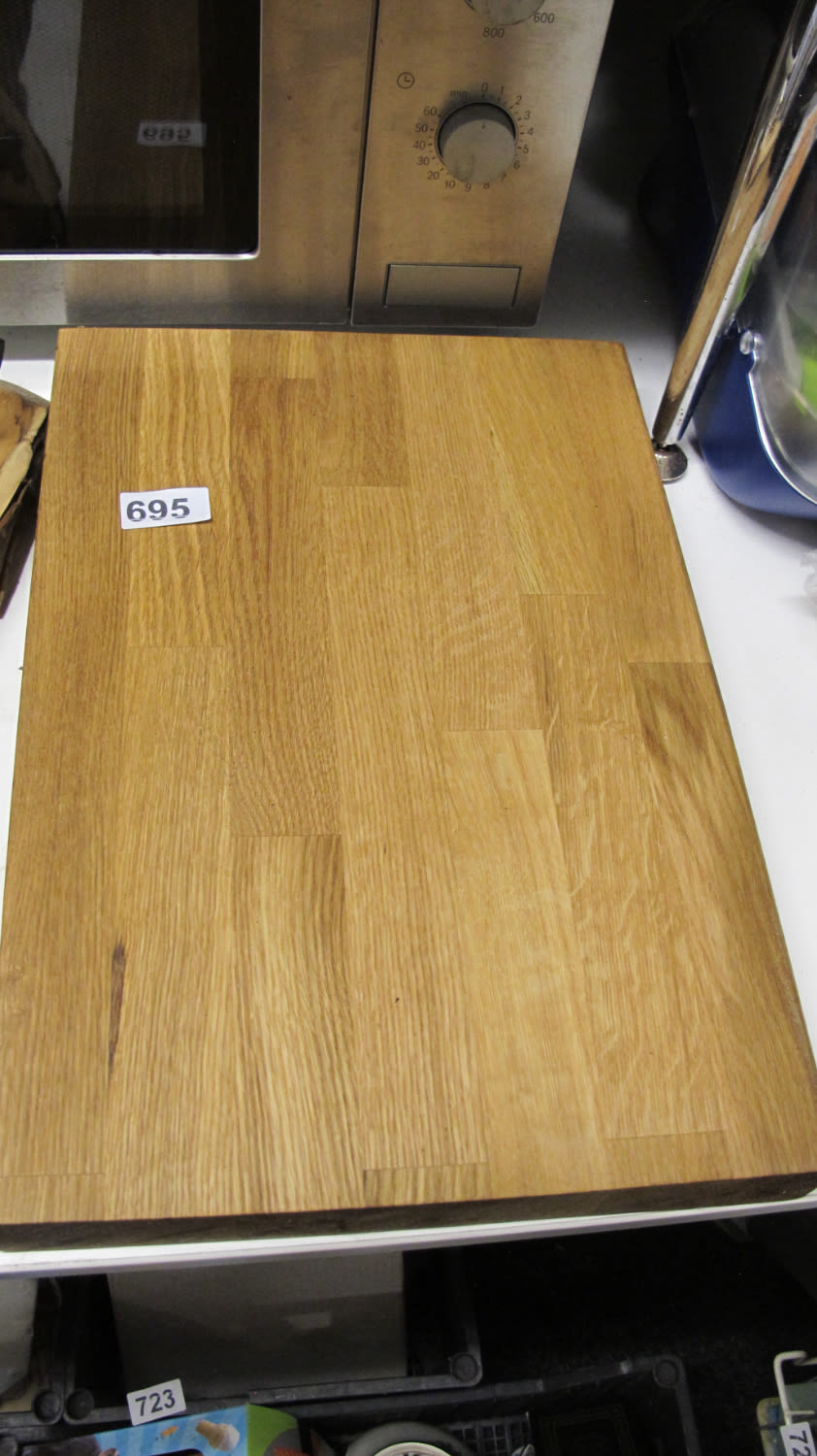 Lot 695: A wooden chopping board