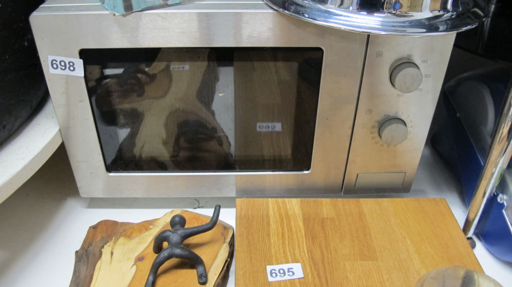 Lot 698: A brushed stainless steel microwave