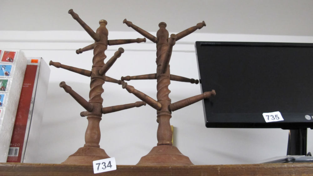 Lot 734: 2 wooden barley twist mug stands