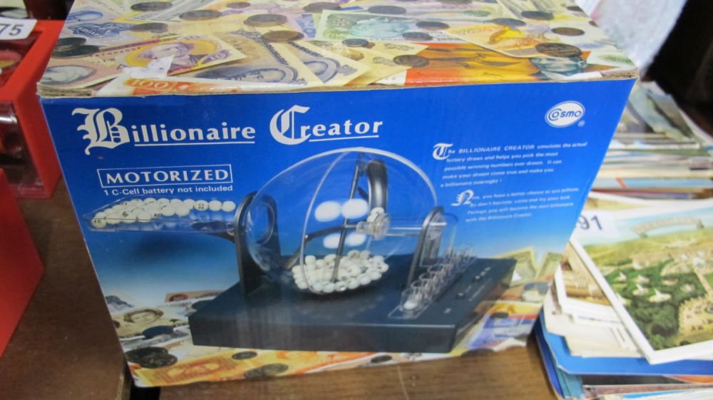 Lot 889: Motorized lottery drawerer