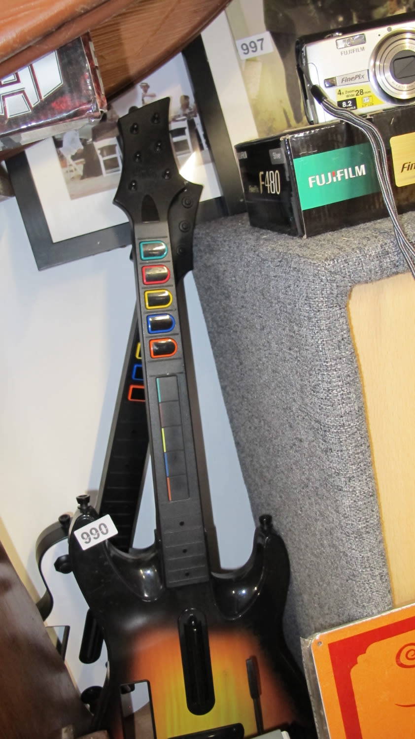 Lot 990: 2 Guitar Hero controllers