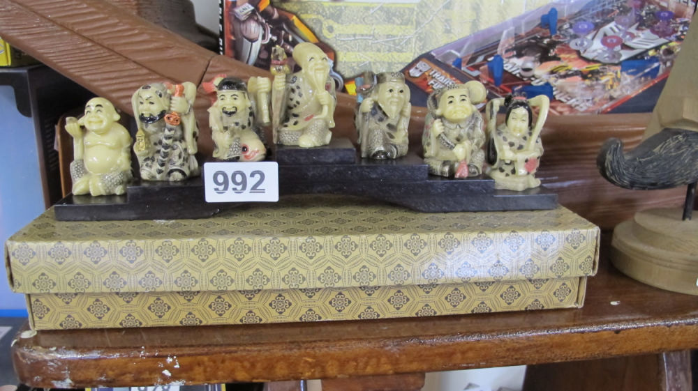 Lot 992: Chinese 7 sage figurines with stand