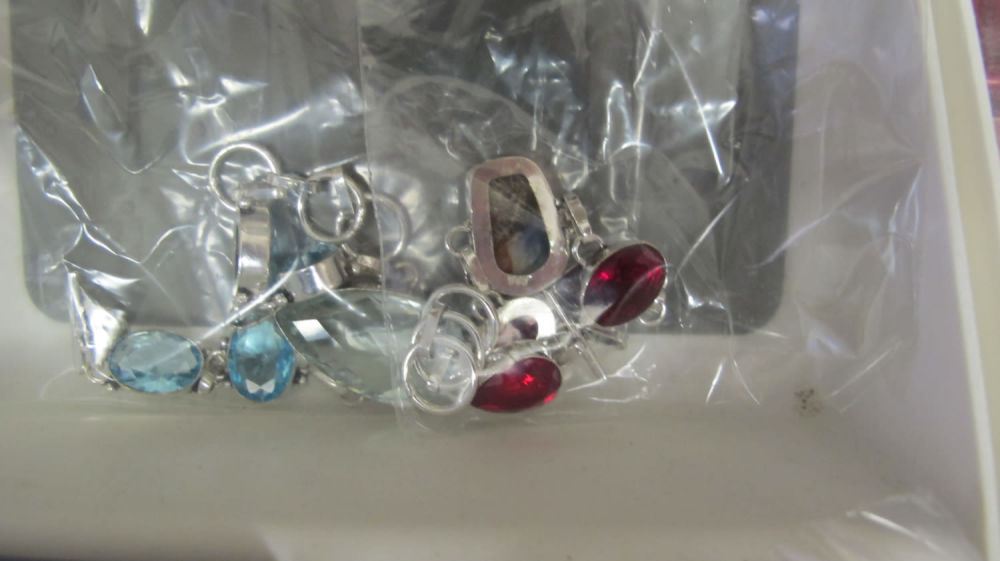 Lot 157: A 925 silver sodalite and garnet bracelet along...