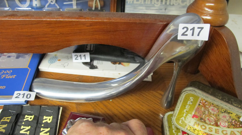 Lot 217: A high heeled aluminium shoe shaped shoe horn