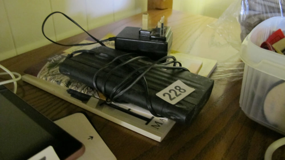 Lot 228: retro psion organiser with manuals etc
