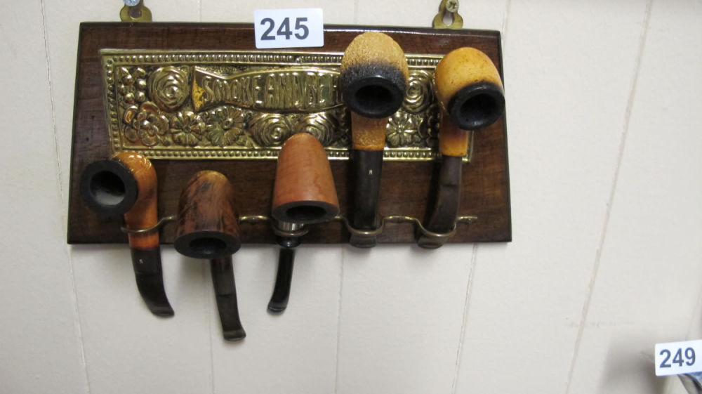 Lot 245: Pipe rack with pipes