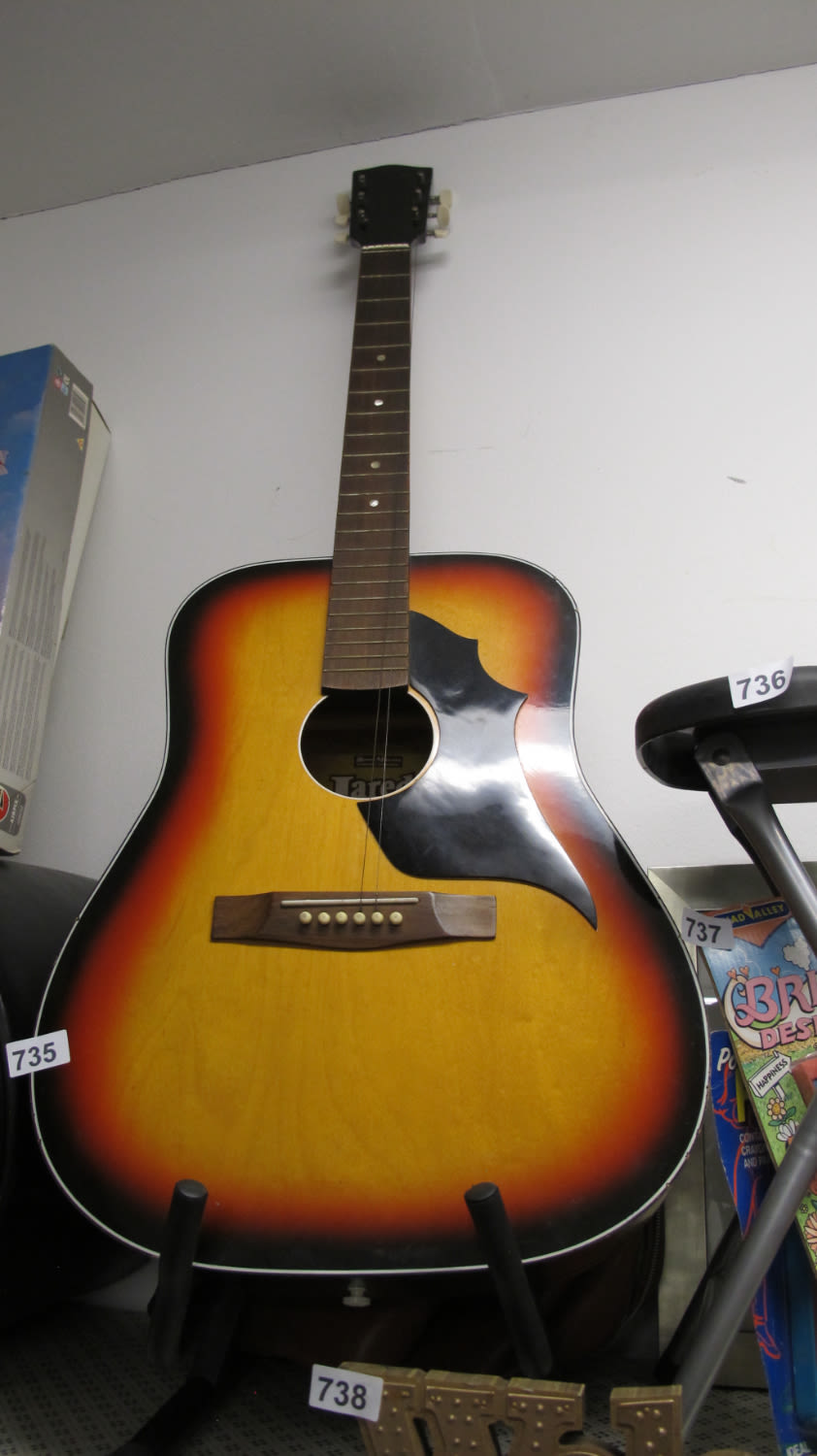 Lot 735: Acoustic guitar and stand needs new strings
