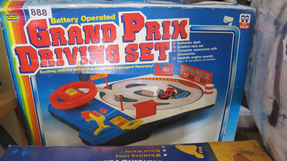 Lot 888: Brand new old stock grand prix driving set