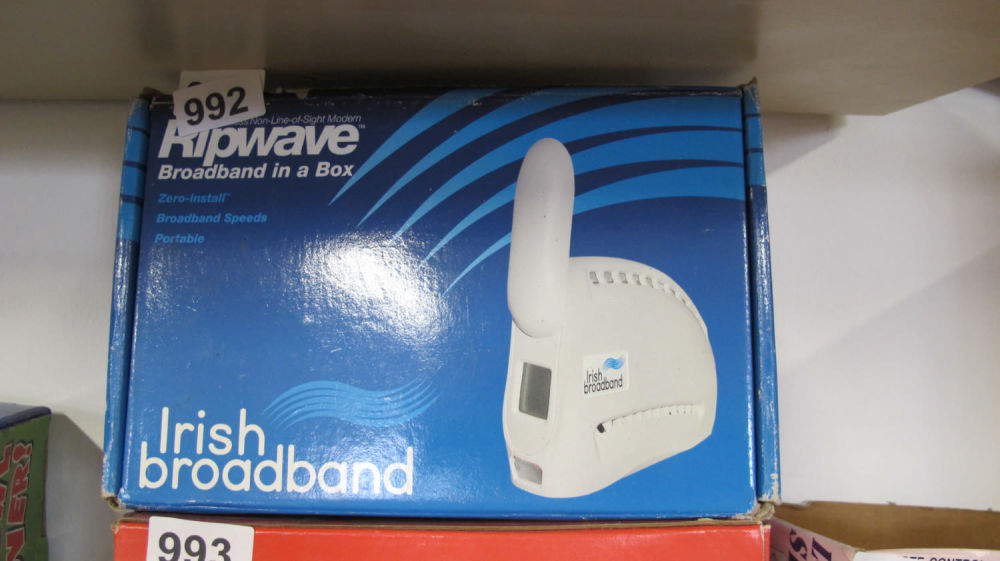 Lot 992: Irish Broadband. Box contains 2 potatoes and a...