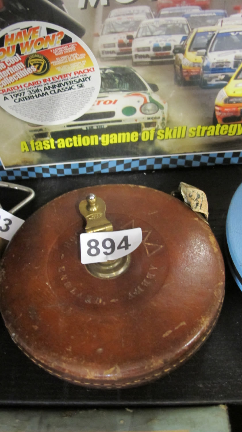 Lot 894: Vintage leather bound tape measure