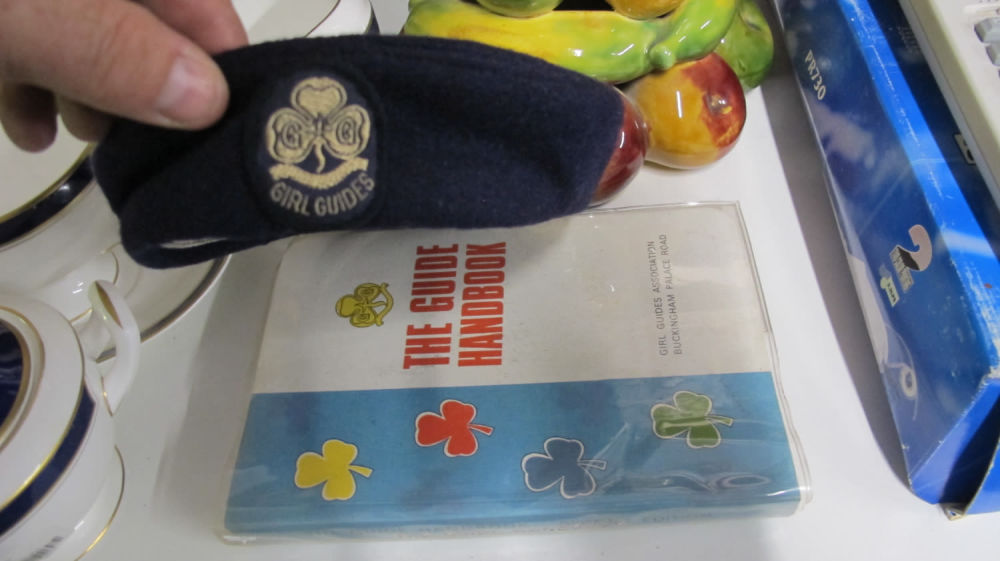 Lot 238: Girl Guides handbook and cap