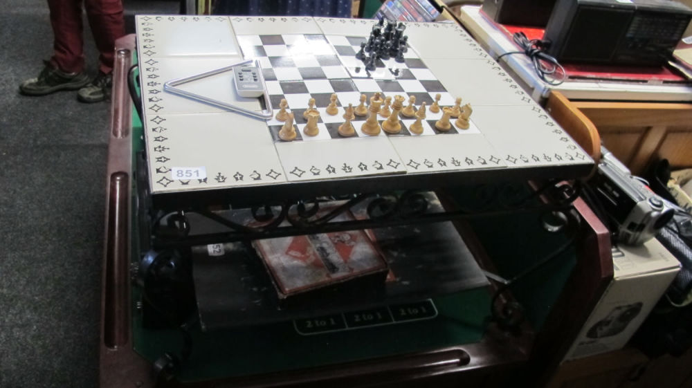 Lot 851: Wrought metal tile topped chess table