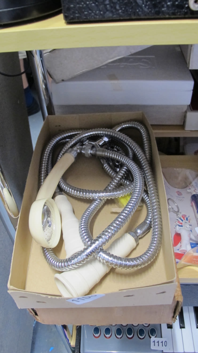 Lot 1106: Shower that goes over the taps. What do...