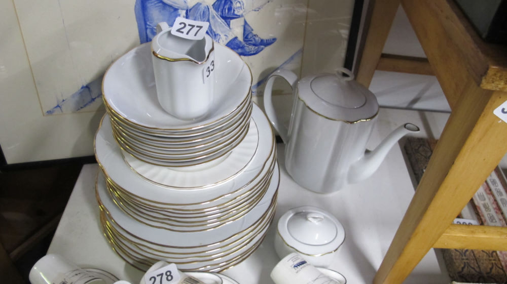 Lot 277: Gilt edged white crockery