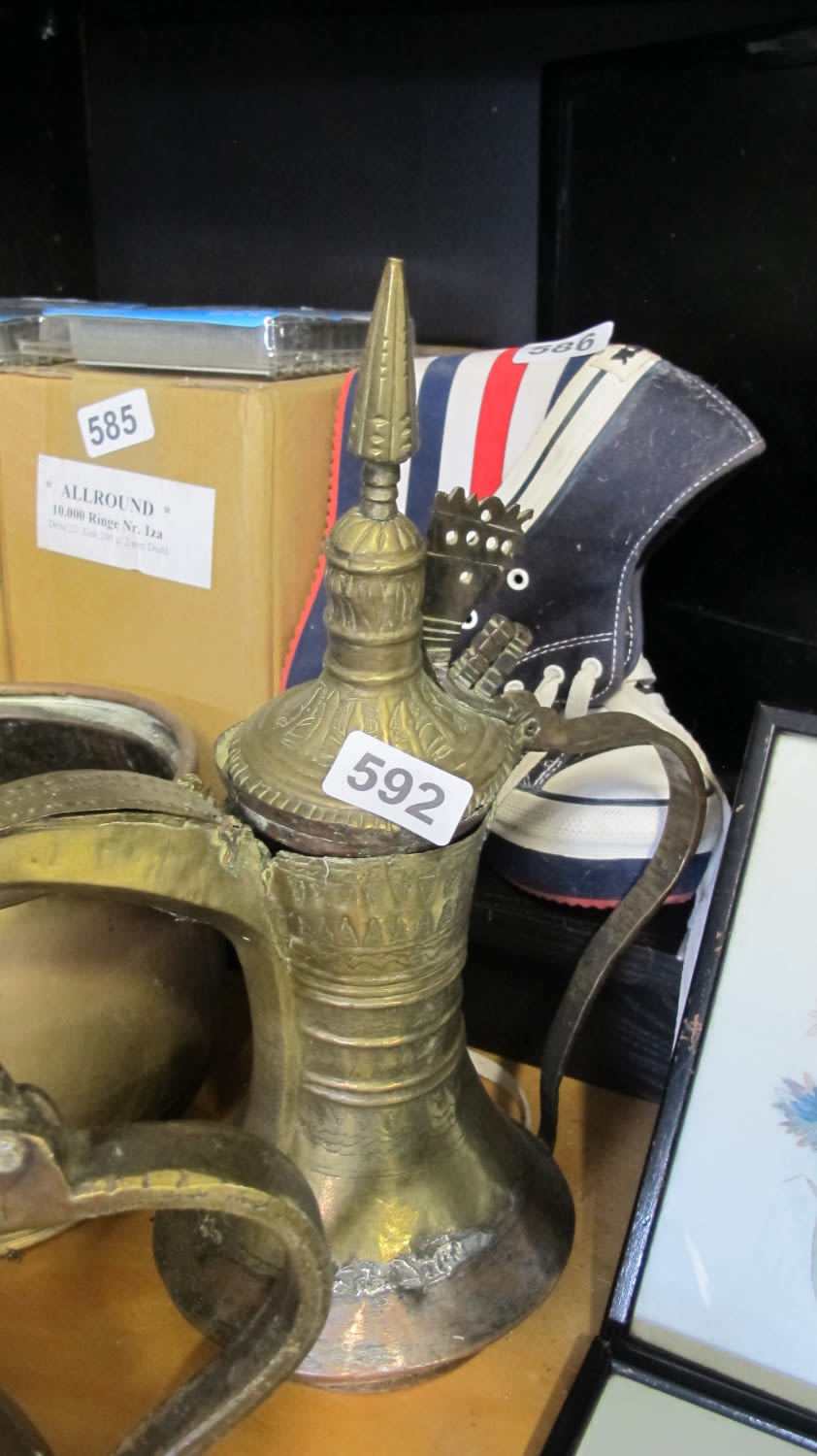 Lot 592: Moroccan brass jug