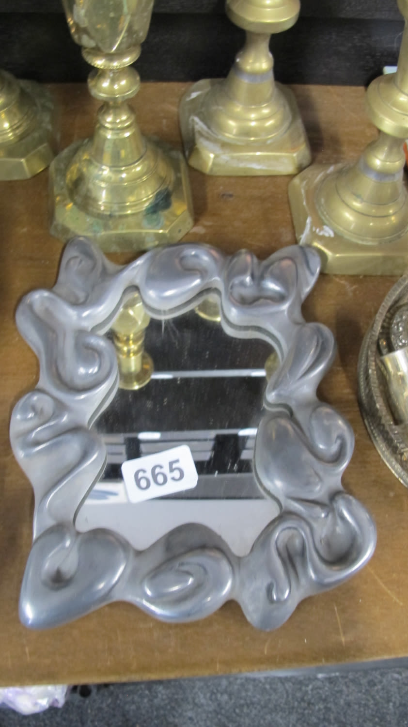 Lot 665: abstract pewter mirror