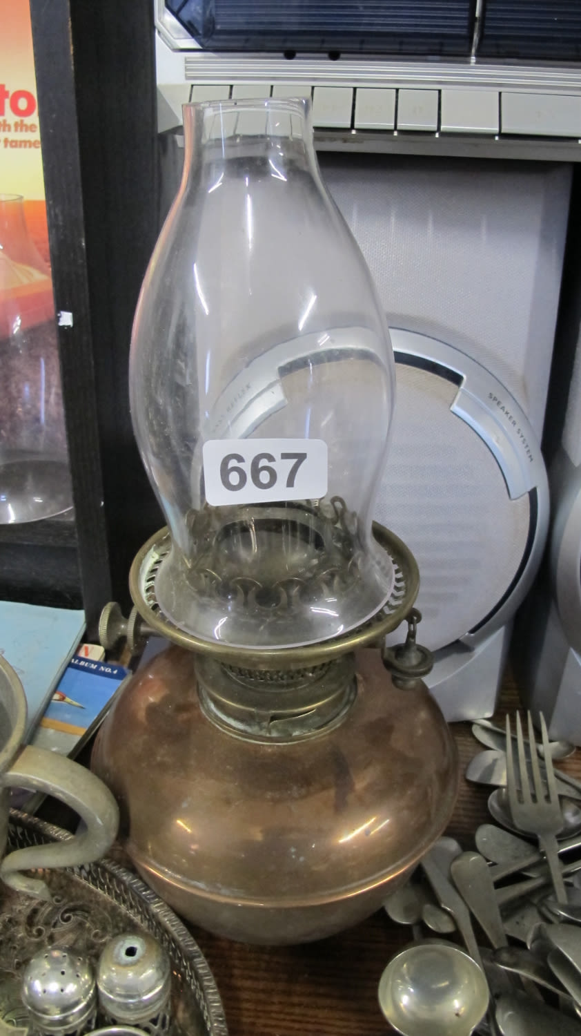 Lot 667: copper oil lamp