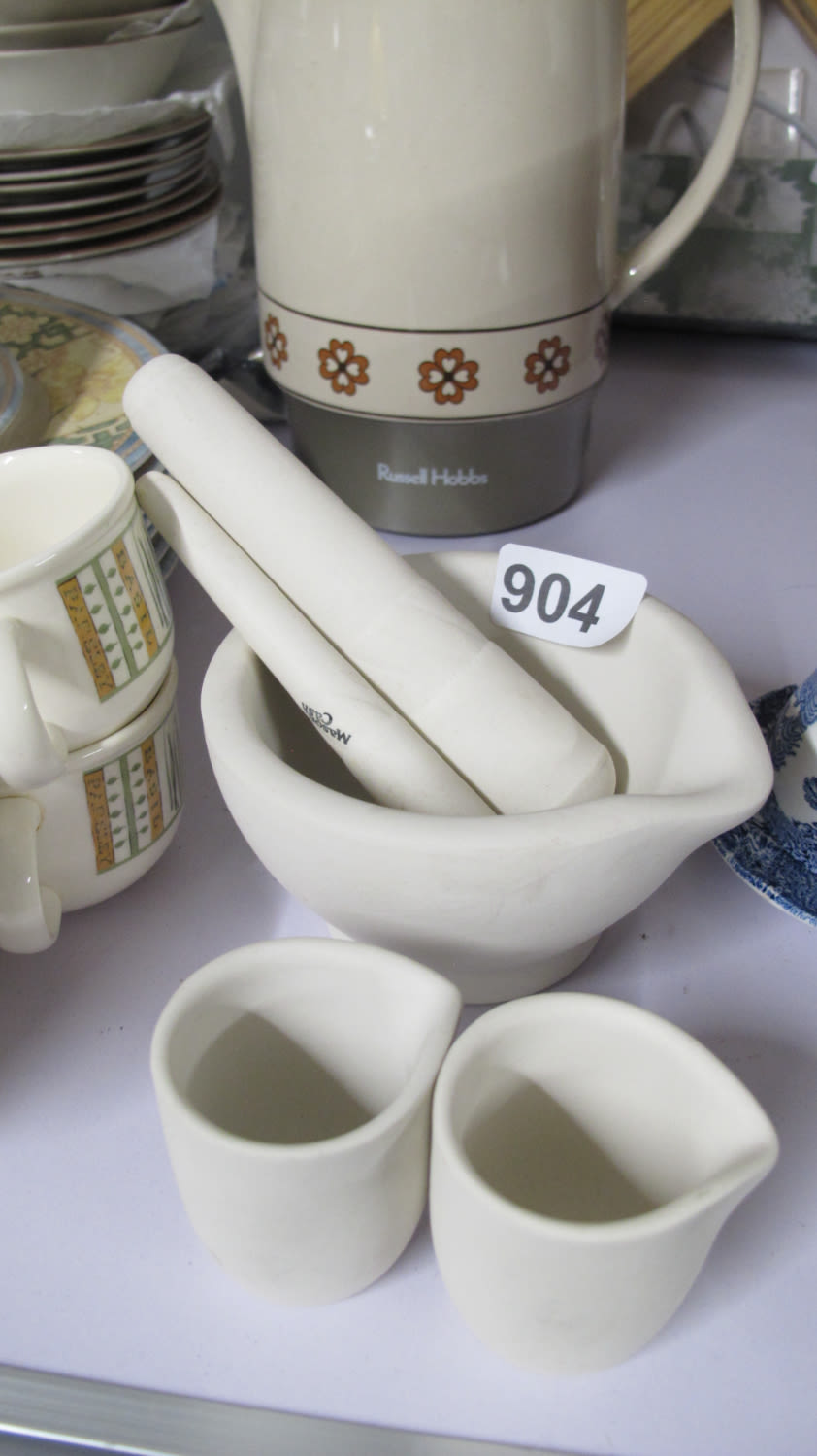 Lot 904: Mortar plus 2 pestles and oil jugs