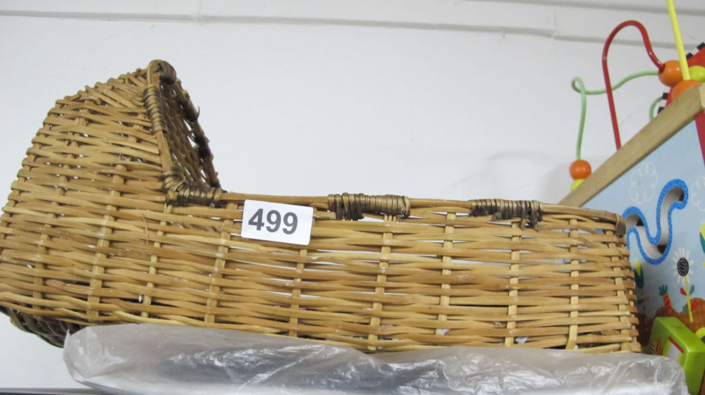 Lot 499: Wicker dolls bed