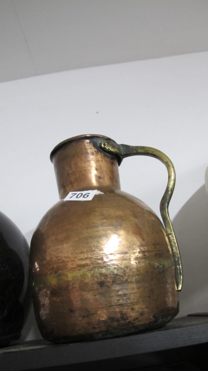 Lot 706: Large antique copper jug
