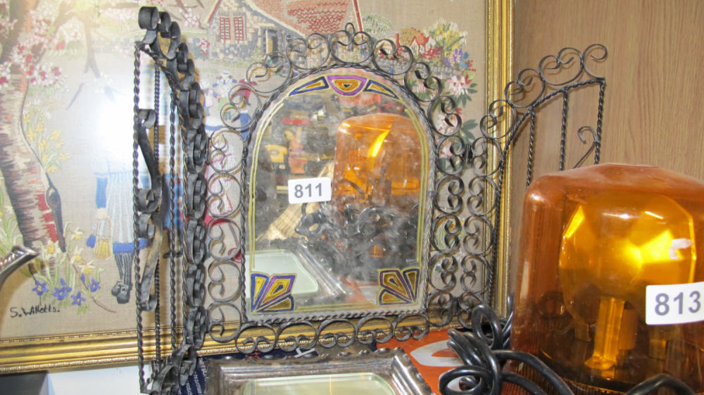 Lot 811: Decorated wrought metal framed mirror