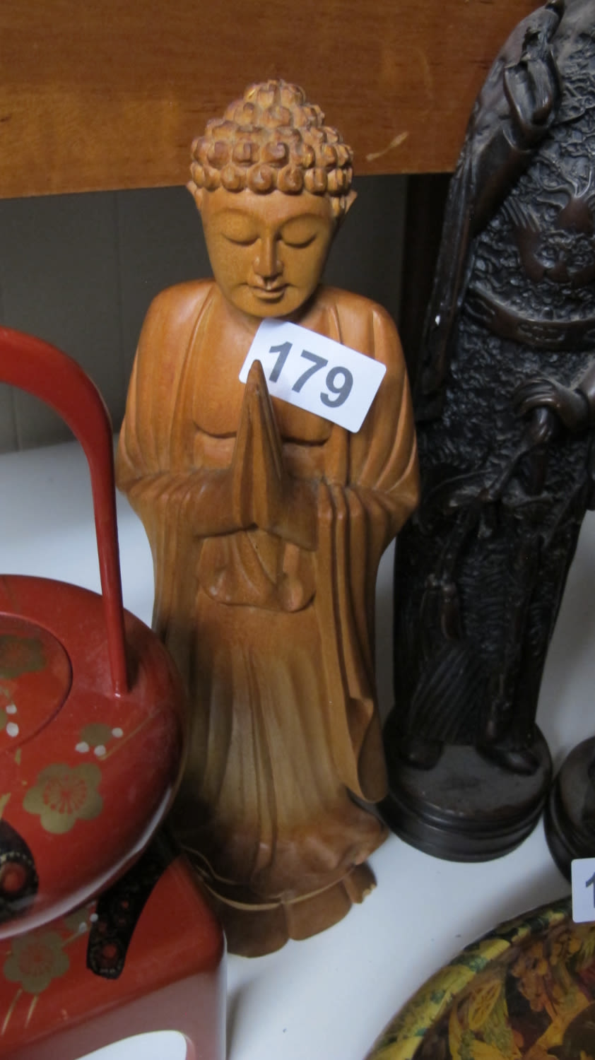 Lot 179: Large wooden Buddha figurine