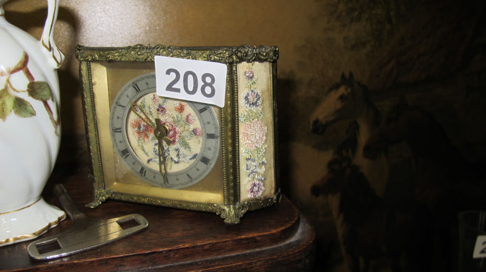 Lot 208: Needlepoint decorated mantel clock. British made