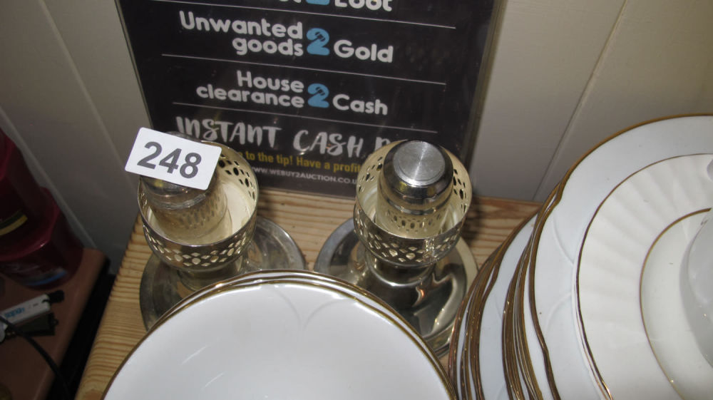 Lot 248: 2 white metal candle sticks