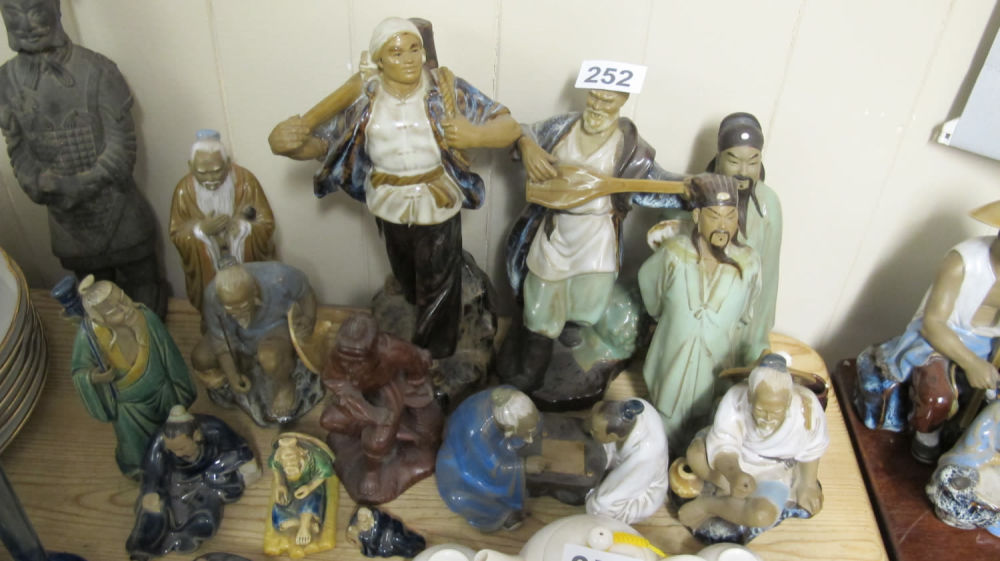 Lot 252: quantity of mud man figures