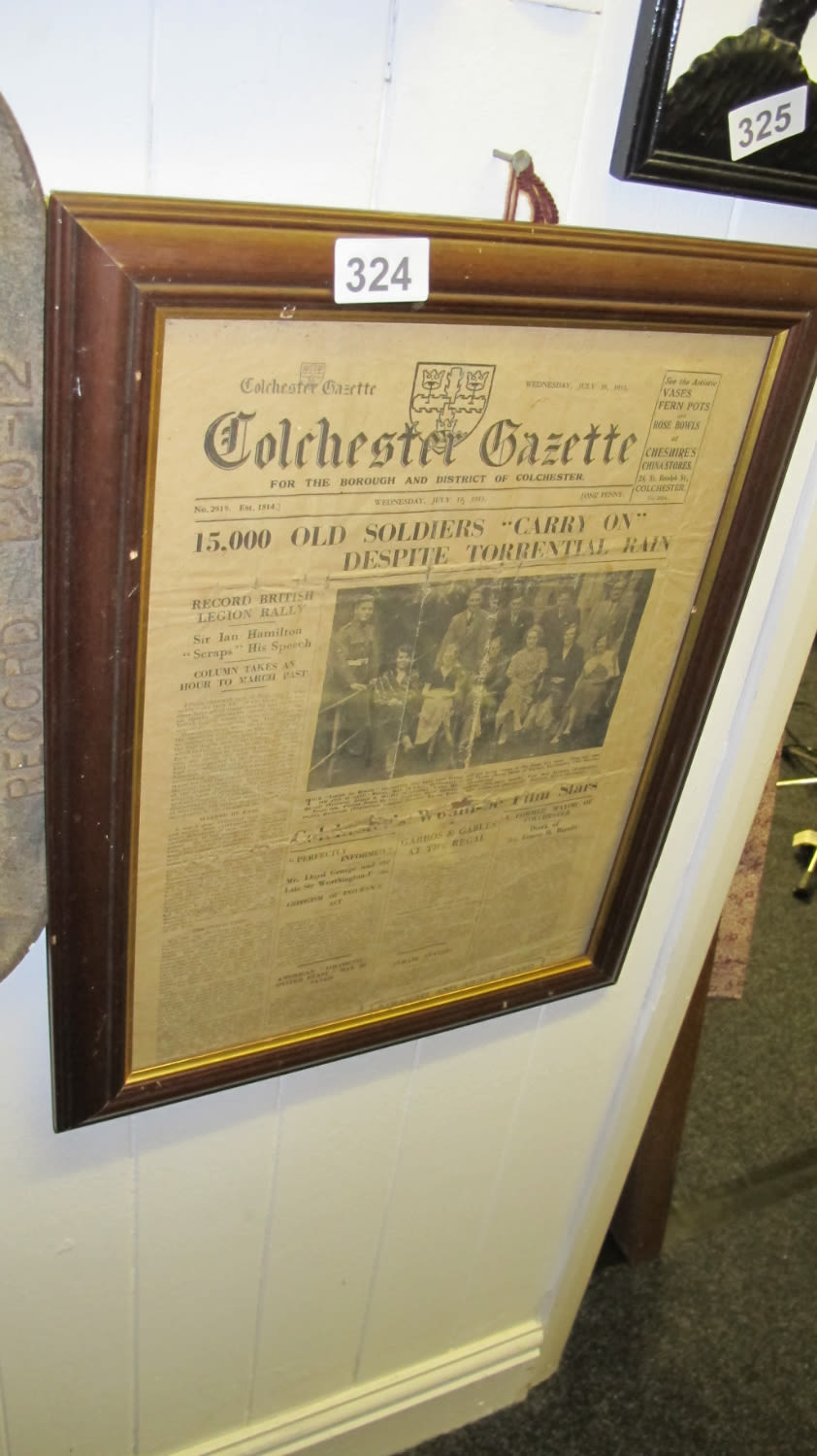 Lot 324: framed newspaper cutting