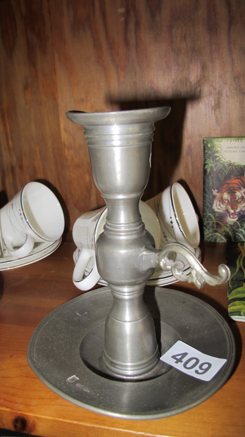 Lot 409: pewter candle stick
