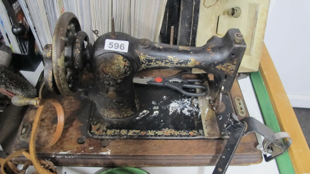 Lot 596: Antique manual sewing machine