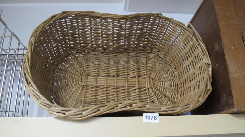 Lot 1076: wicker dog basket