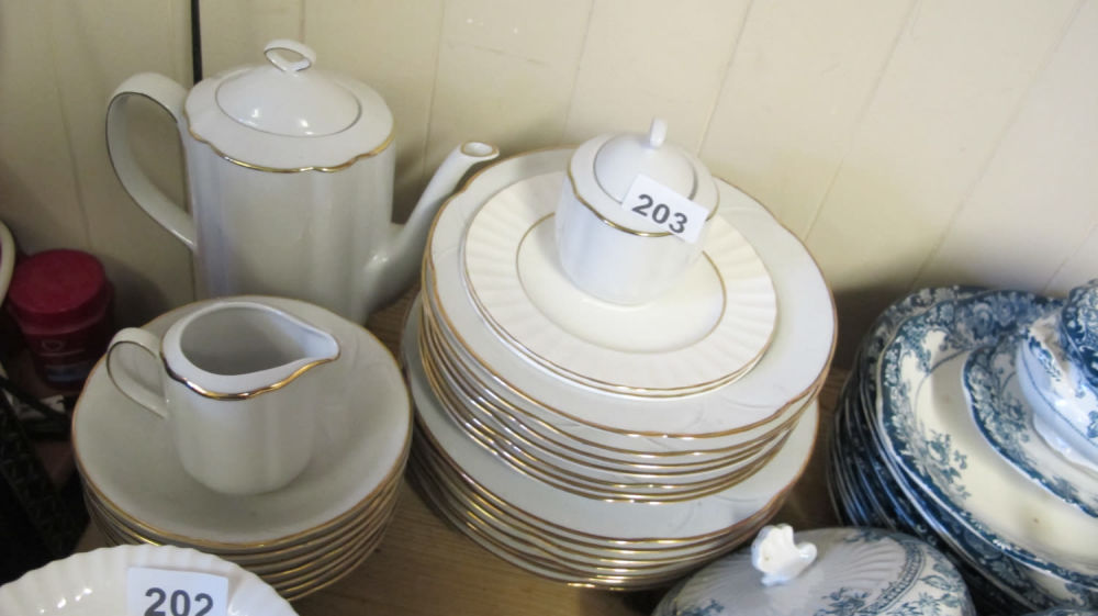 Lot 203: Gilt edged white part dinner service