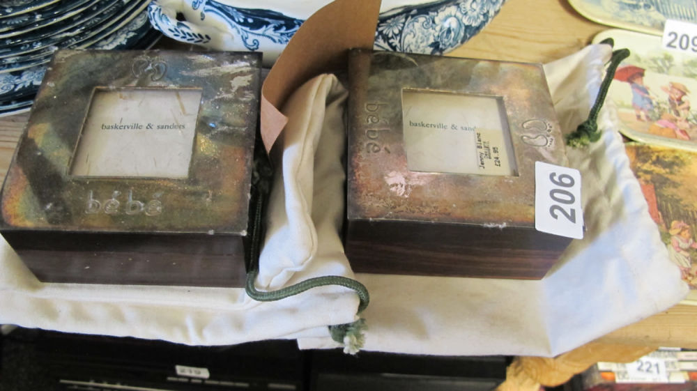 Lot 206: 2 Baskerville and Sanders silver plated baby memory...