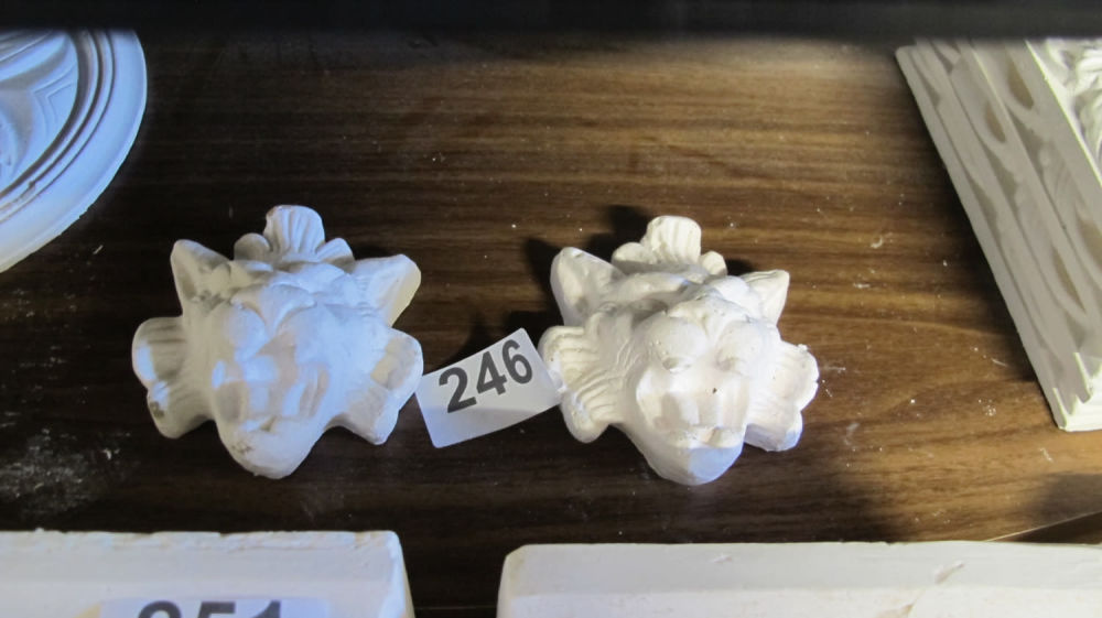 Lot 246: 2 small lion head plaster moulding decorations