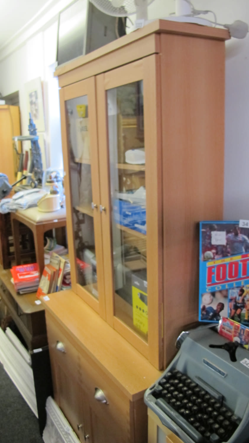 Lot 334: Large cupboard/book shelves